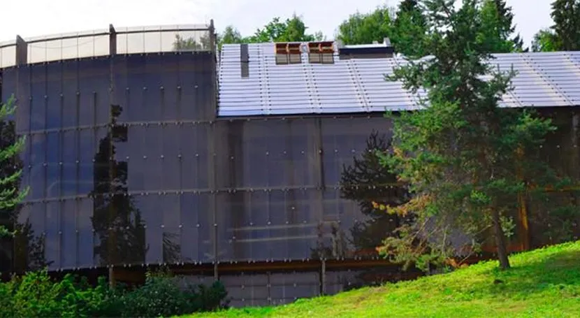 Exterior view of VEAS wastewater treatment plant surrounded by greenery