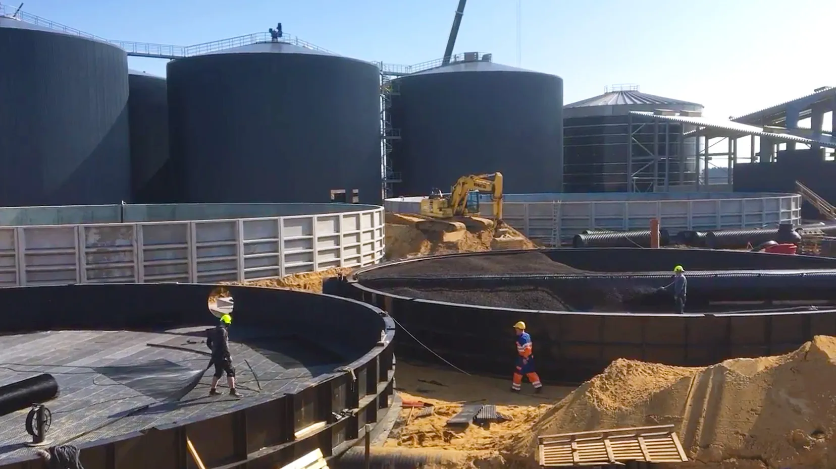 Workers installing Filtralite filter media in the odour treatment filters at the Nature Energy Nordfyn biogas plant